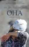 Она